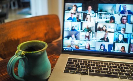 laptop with video conference on screen